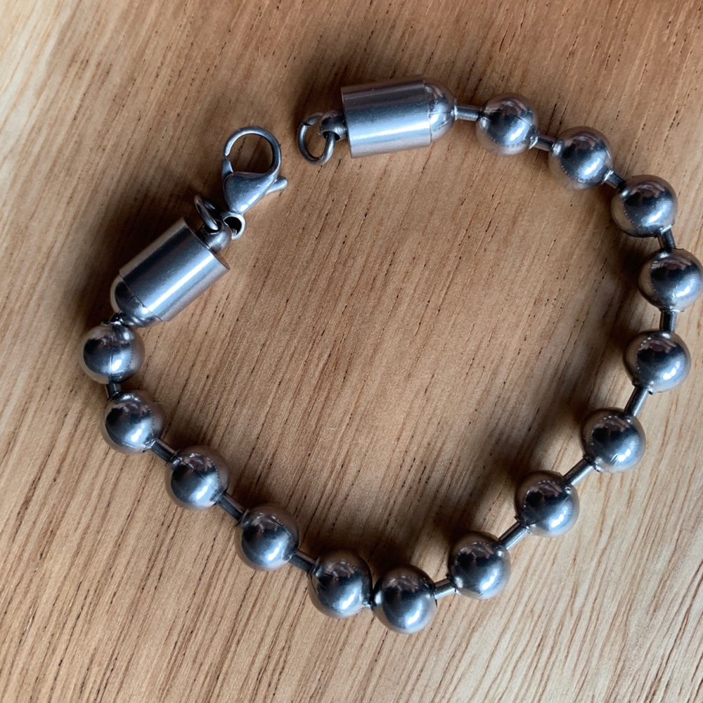 Grungy stainless steel men’s bead bracelet.